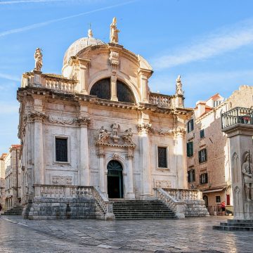 Dedicated to the city's protector, the 18th-century Baroque Church of Saint Blaise stands prominently on Luža Square, housing a revered silver statue of the patron saint holding a model of medieval Dubrovnik.