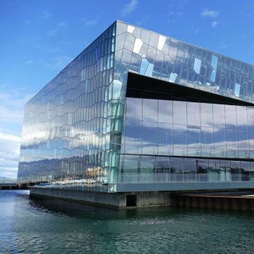 Set along the waterfront, Harpa is an architectural marvel celebrated for its striking geometric glass honeycomb facade inspired by Iceland's basalt landscape.