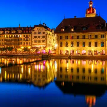 The Lucerne Town Hall is a Renaissance masterpiece built between 1602 and 1606, featuring a distinctive red-tiled roof and a grand clock tower that overlooks the bustling Kornmarkt. Originally serving as both a grain store and a seat of government, the building remains one of Switzerland's most beautiful public structures and serves as a centerpiece of the city's medieval old town.