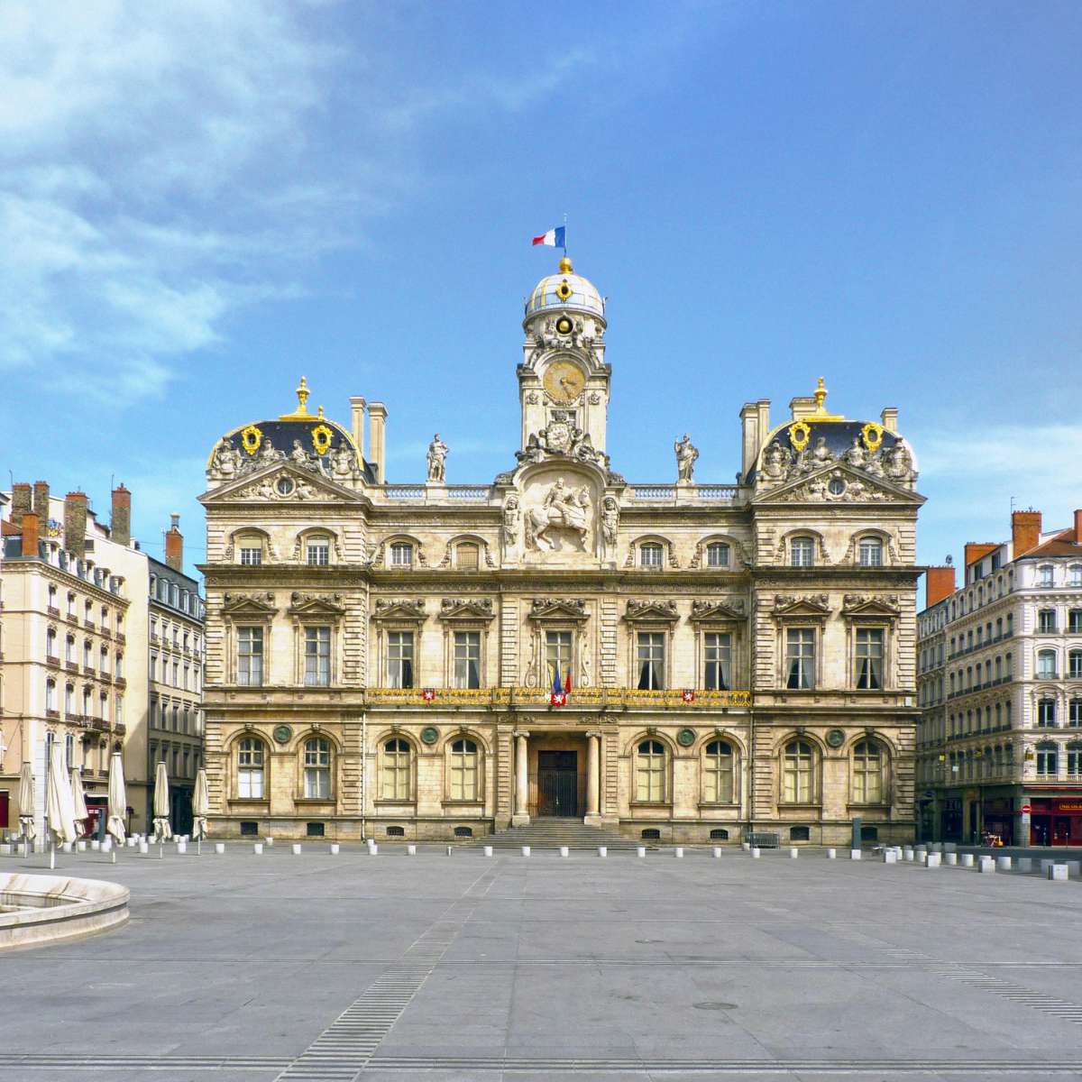 Lyon Scavenger Hunt and Self-Guided Tour 2 The Hôtel de Ville is a majestic Baroque landmark where a grand ornate facade and a historic bell tower create a monumental centerpiece for Lyon’s Place des Terreaux.