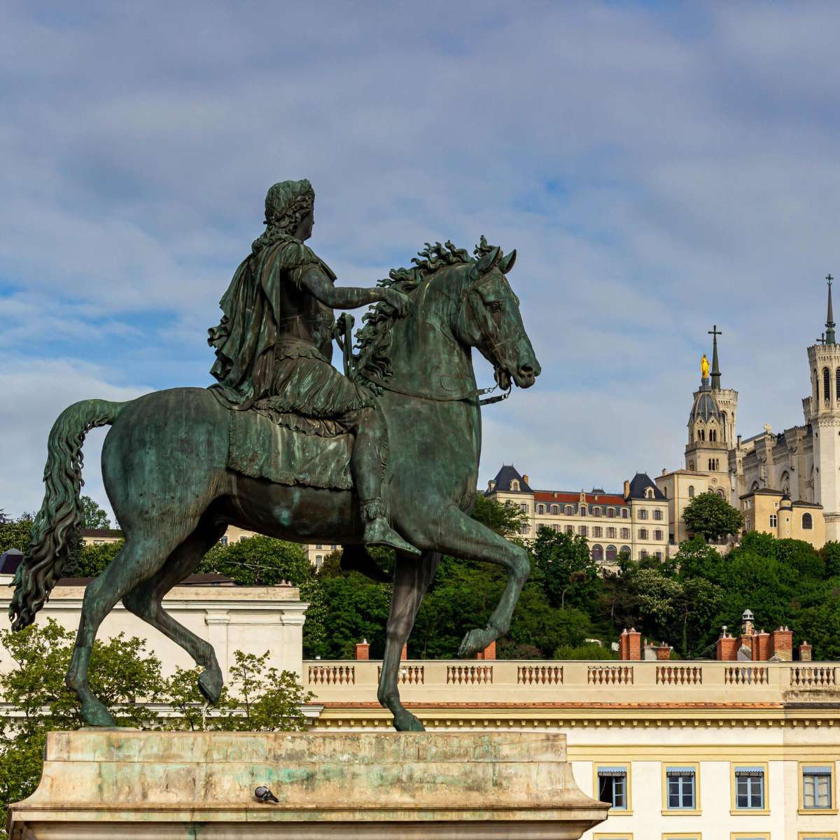 Lyon Scavenger Hunt and Self-Guided Tour 6 Place Bellecour is a majestic open square where a grand equestrian statue of Louis XIV and views of the Fourvière hilltop create a monumental gateway to Lyon’s city center.