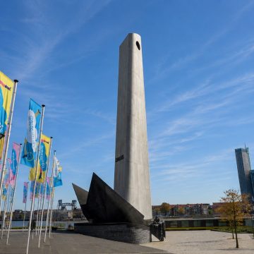 Standing prominently along the Boompjes on the Nieuwe Maas, De Boeg is the Netherlands' national merchant navy memorial, shaped like a ship's bow slicing through stylized waves to honor the thousands of merchant sailors lost in World War II.