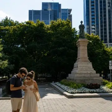 Victoria Square in Montreal is an elegant urban plaza in the heart of the city, combining landscaped spaces, historic architecture, public art, and a prominent statue of Queen Victoria.