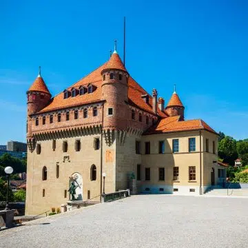 Perched commanding at the northern crest of Lausanne's Old Town hill, Château St-Maire is a sturdy, brick-topped fourteenth-century fortress originally constructed for regional prince-bishops that continues to house the cantonal government today.