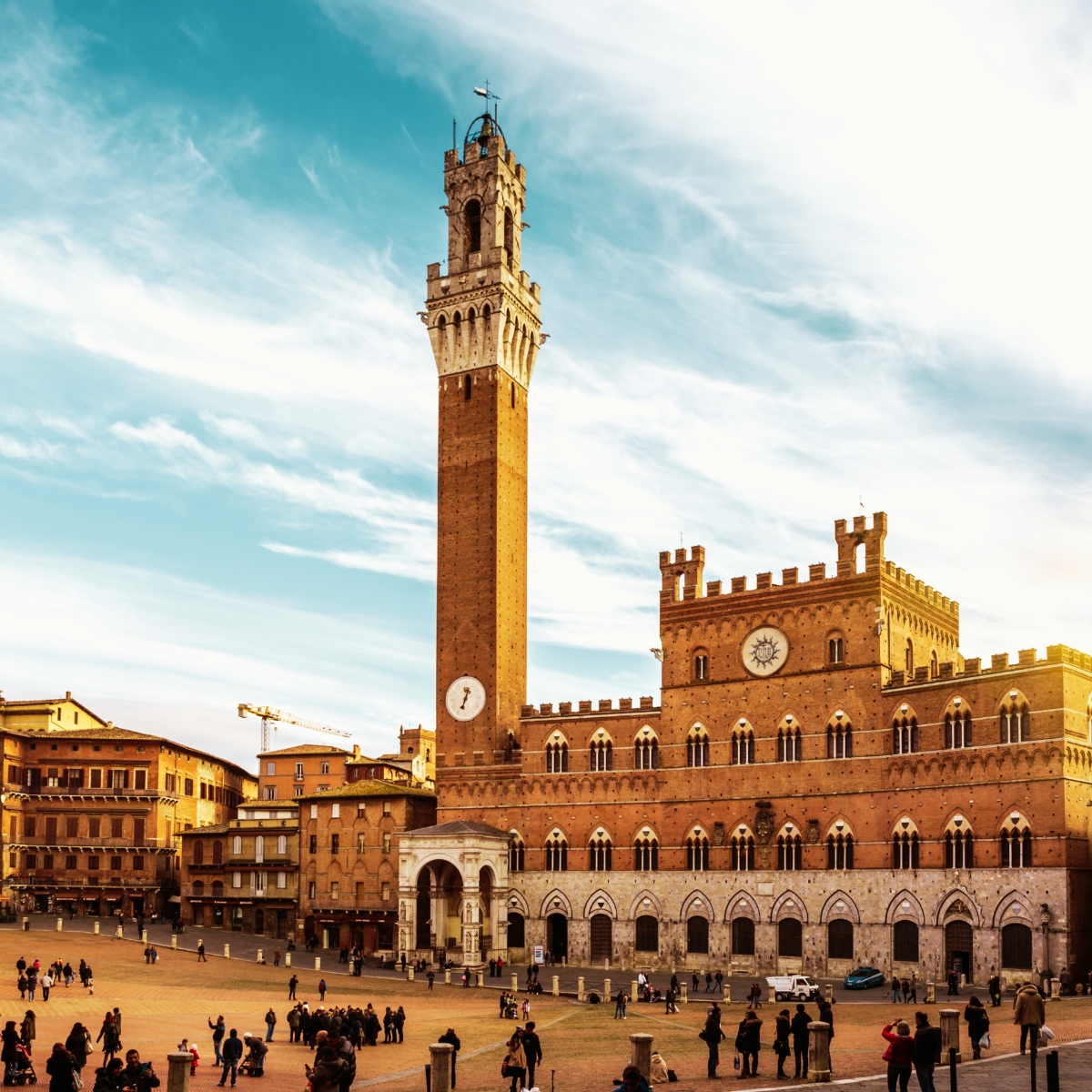 Siena Scavenger Hunt and Self-Guided Tour 3 Palazzo Pubblico is a majestic Gothic landmark where a grand brick facade and the soaring Torre del Mangia create a monumental symbol of Siena’s civic power and artistic heritage.