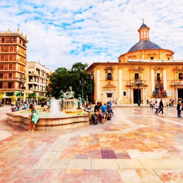 Plaça de la Verge in Valencia Plaça de la Verge is a majestic historic square where the Turia Fountain and the surrounding cathedral architecture create the serene and ancient heart of Valencia.