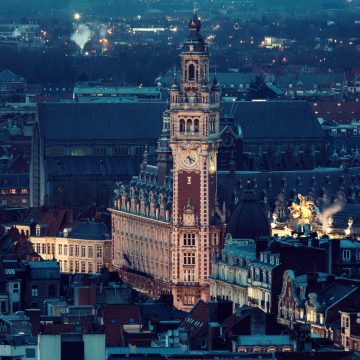 The Belfry of the Lille Chamber of Commerce is a stunning 76-meter-high Neo-Flemish tower that features an ornate clock face and a famous carillon of 25 bells.