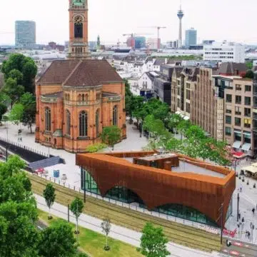 Framed by the striking neo-Gothic Johanneskirche, Martin-Luther-Platz serves as a stately open square marked by grand historic monuments and landscaped walkways.