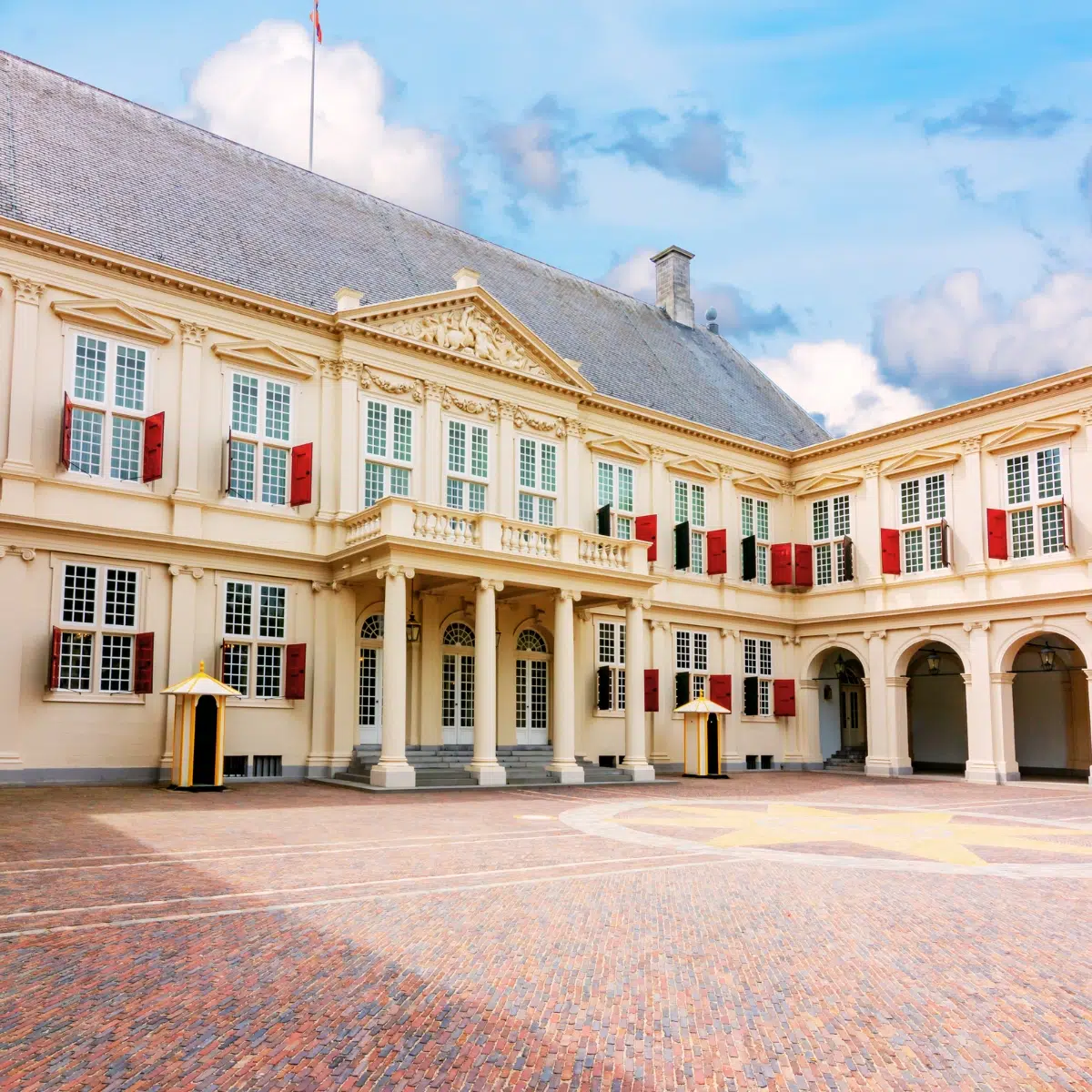 The Hague Scavenger Hunt and Self-Guided Tour 6 Noordeinde Palace is a majestic working palace where a grand neoclassical facade and elegant royal gardens create a monumental landmark in the heart of The Hague.