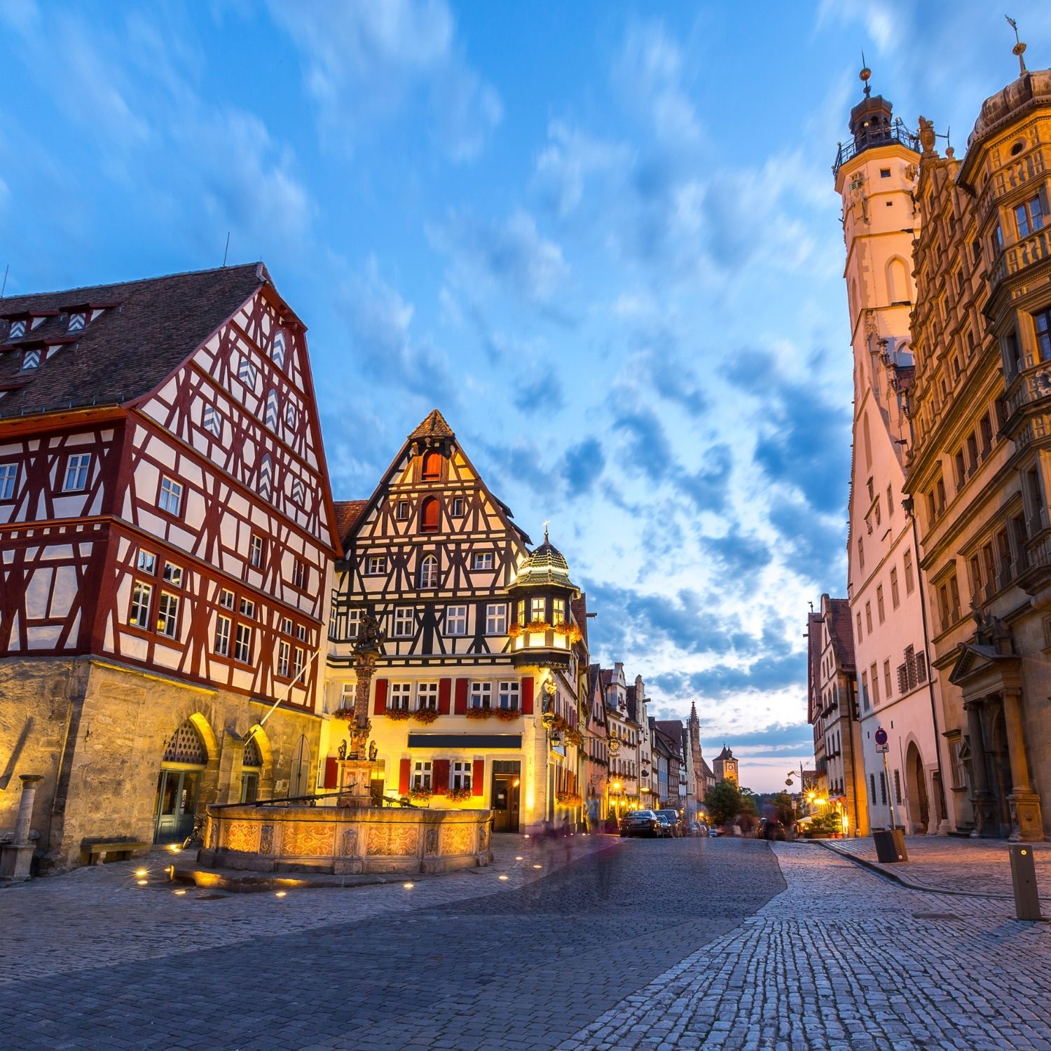 Rothenburg Scavenger Hunt and Self-Guided Tour 3 Dominating the central Market Square, this ornate Renaissance well dating back to 1608 features a towering column capped by a stone figure of Saint George slaying the dragon, standing as both a vital historic water source and a masterwork of medieval civic craftsmanship.
