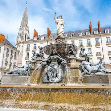 Designed in the late 18th century by architect Mathurin Crucy, Place Royale is a grand neoclassical pedestrian square centered around a monumental fountain symbolizing the city of Nantes and the River Loire.