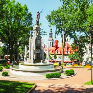 Place d'Armes is a historic public square in Old Québec that serves as a central gathering point surrounded by iconic landmarks.