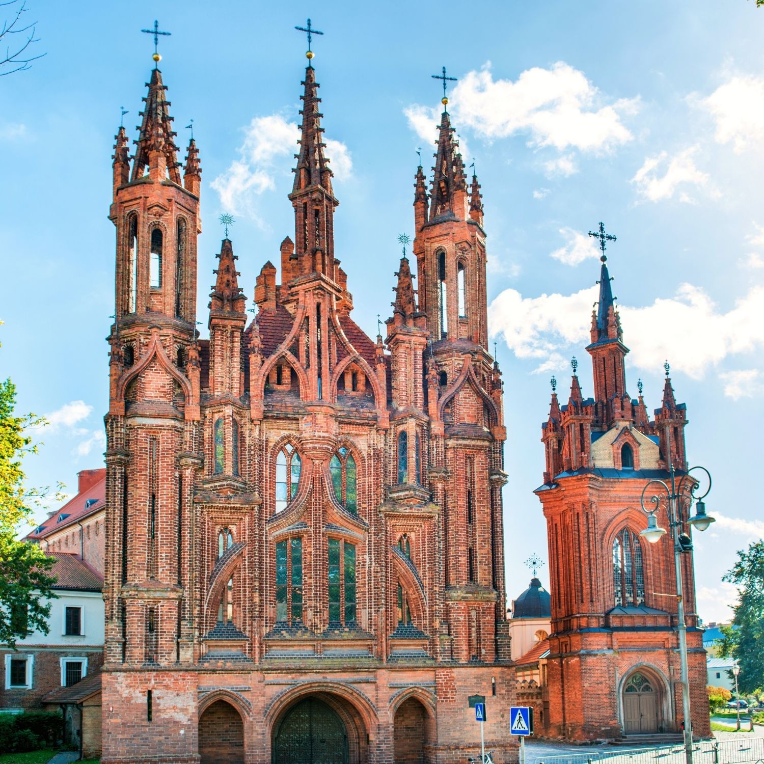 Caccia al tesoro e tour autoguidato a Vilnius 6 Perched beside the Vilnia River, this late-fifteenth-century landmark stands out for its intricate, flame-like brick facade that survived centuries of warfare virtually untouched.