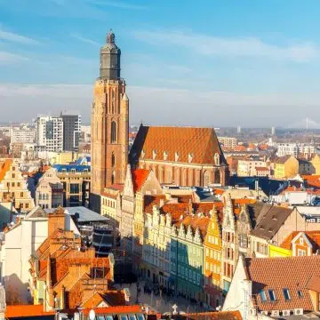 Towering over the northwest corner of the Market Square, the monumental 14th-century Gothic St. Elizabeth of Hungary Church draws explorers in with its soaring 91-meter viewing tower, rich military-parish heritage, and centuries of resilient Silesian lore waiting to be discovered.