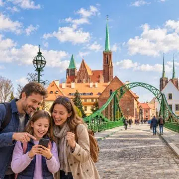 Spanning the Odra River to connect Sand Island with historic Ostrów Tumski, the striking turquoise-green, 19th-century steel-arched Tumski Bridge welcomes explorers with guardian statues, gas-lit romance, and centuries of riverside legend.