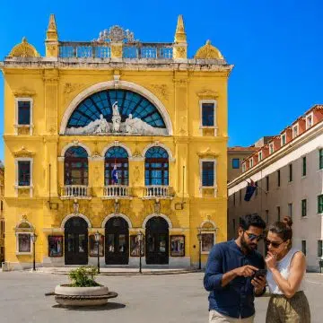 Dating back to 1893 on Gajo Bulat Square, the Croatian National Theater in Split features a striking canary-yellow neo-Baroque facade and serves as the vibrant cultural heart of Dalmatian performing arts.