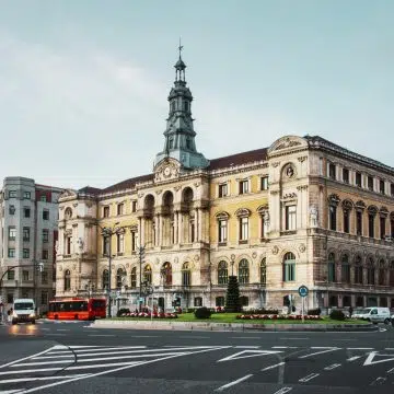 Bilbao City Hall is a majestic Neoclassical landmark where a grand ornate facade and the opulent Arab Salon create a monumental symbol of the city’s civic history along the Nervión River.
