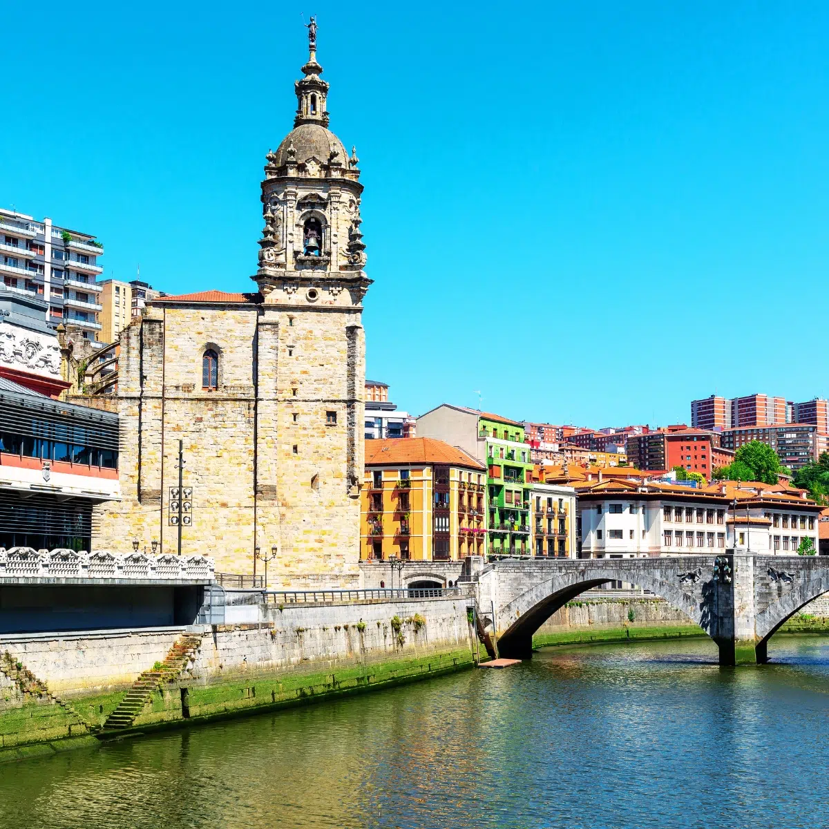 Bilbao Scavenger Hunt and Self-Guided Tour 3 San Anton Church is a majestic Gothic landmark where a grand stone facade and its historic location beside the river create a monumental presence in Bilbao’s Old Town.
