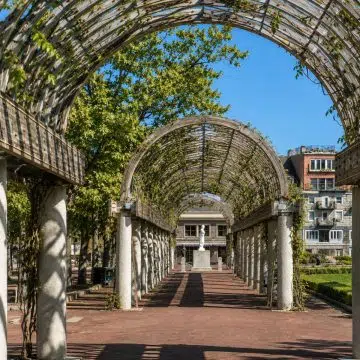 Christopher Columbus Waterfront Park is a picturesque waterfront park known for its beautiful harbor views, rose-covered trellis, and peaceful atmosphere along Boston’s historic shoreline.
