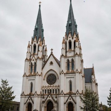 The Cathedral Basilica of St. John the Baptist is a majestic French Gothic masterpiece with towering twin spires and ornate stained glass.