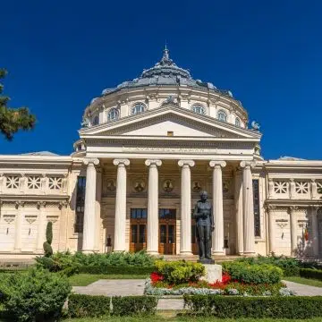 The Romanian Athenaeum in Bucharest is an impressive neoclassical concert hall, instantly recognizable by its grand columned entrance, elegant dome, and richly decorated interior.