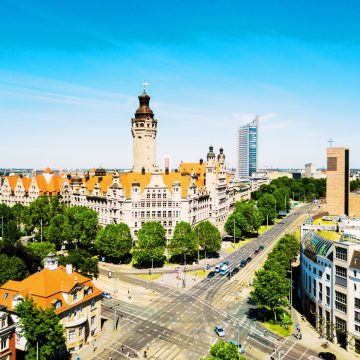 The New Town Hall is a monumental castle-like structure featuring the tallest city hall tower in Germany, built upon the foundations of the historic Pleissenburg fortress.
