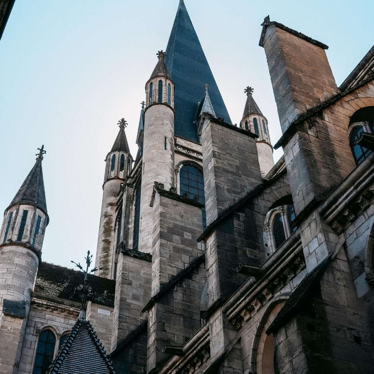 Dijon Scavenger Hunt and Self-Guided Tour 5 The Church of Notre-Dame of Dijon is a majestic 13th-century Gothic masterpiece famous for its unique row of decorative gargoyles and the legendary carved owl that brings good luck to all who touch it.