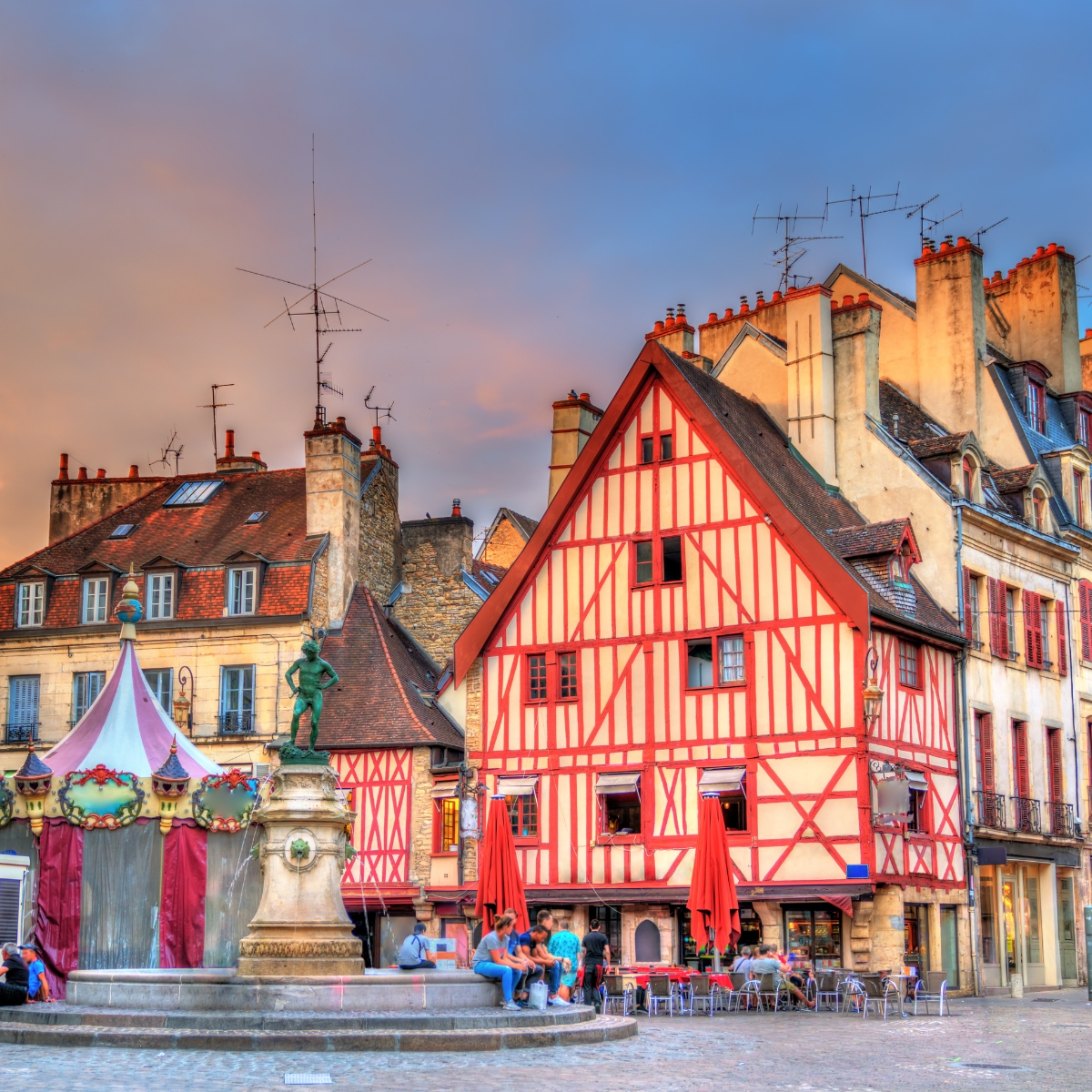 Dijon Scavenger Hunt and Self-Guided Tour 3 Place François-Rude is a majestic central square where half-timbered houses and the iconic Bareuzai fountain create a picturesque heart in the center of Dijon.