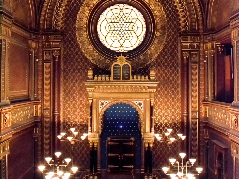 Prague: Ornate interior of the Spanish Synagogue in Prague's Jewish Quarter, adorned with intricate Moorish-style patterns, gold leaf, and vibrant colors.