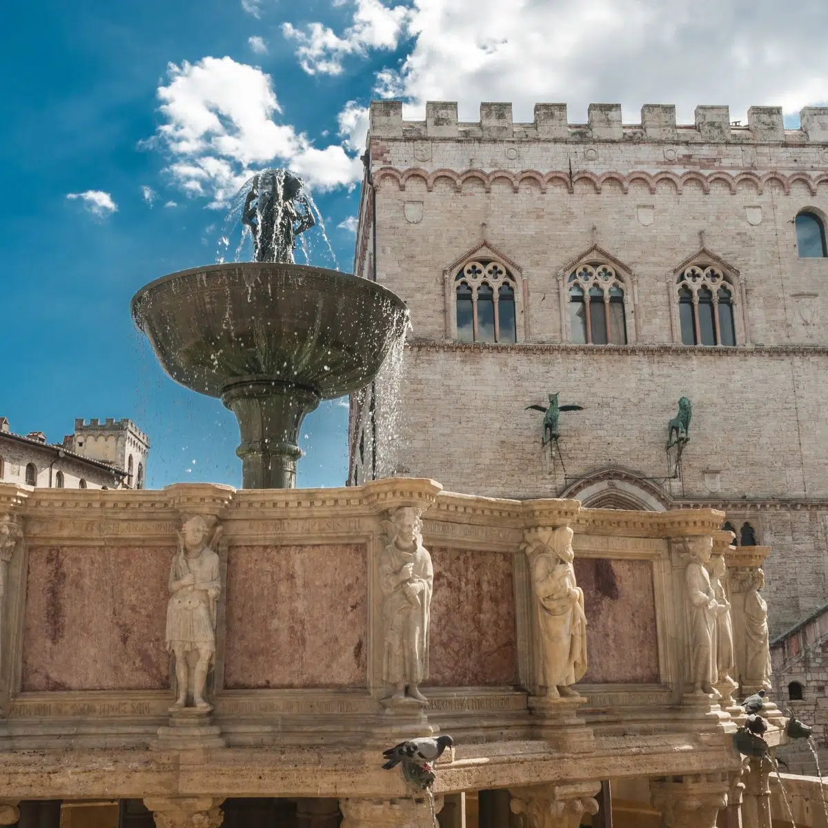 Perugia Scavenger Hunt and Self-Guided Tour 3 Fontana Maggiore is a magnificent medieval fountain adorned with intricate marble sculptures and detailed carvings that symbolize the artistic and civic pride of Perugia.