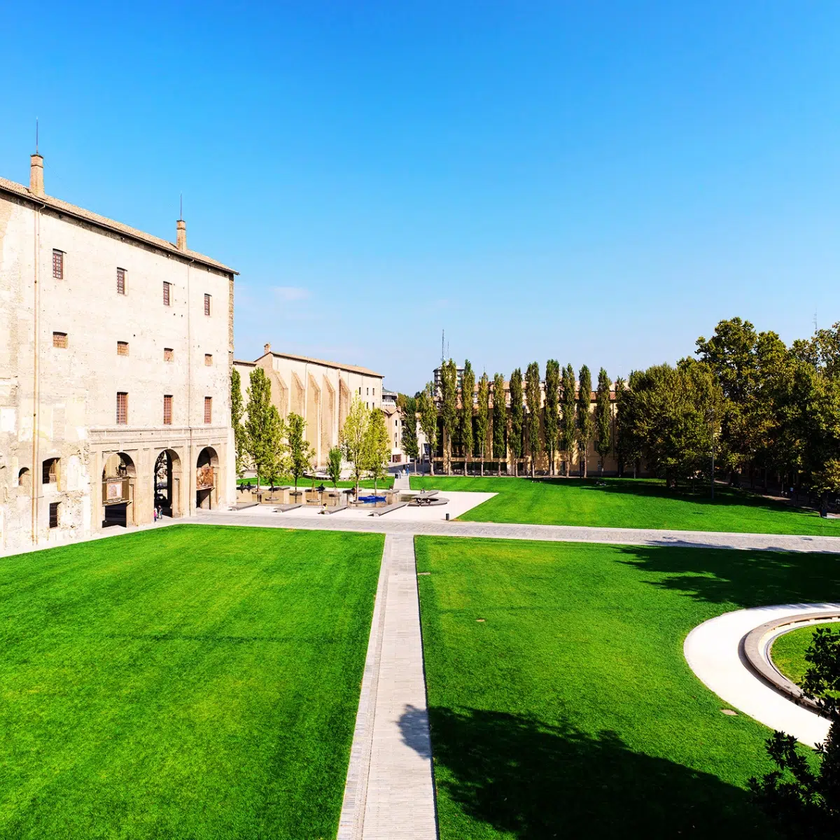 Parma Scavenger Hunt and Self-Guided Tour 5 Piazzale della Pace is a grand urban green space in the heart of Parma, offering a striking contrast between its lush lawns and the imposing brick facade of the historic Palazzo della Pilotta.