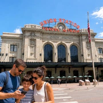 Originally opened in 1881 and rebuilt in 1914 in the Beaux-Arts style, Denver's historic Union Station anchors the Lower Downtown (LoDo) district as a bustling multimodal transit hub and vibrant civic gathering place featuring the soaring Great Hall, boutique shops, and dining.